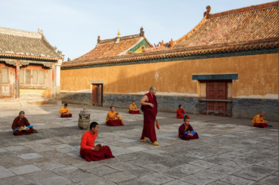 Senior monk Lobsang Rabten oversees an evening scripture recital at Amarbayasgalant Monastery. Photo by Thomas Peter. From reuters.com