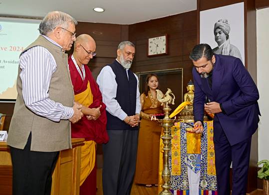 Participants at the 2nd Buddhist media conclave light a lamp