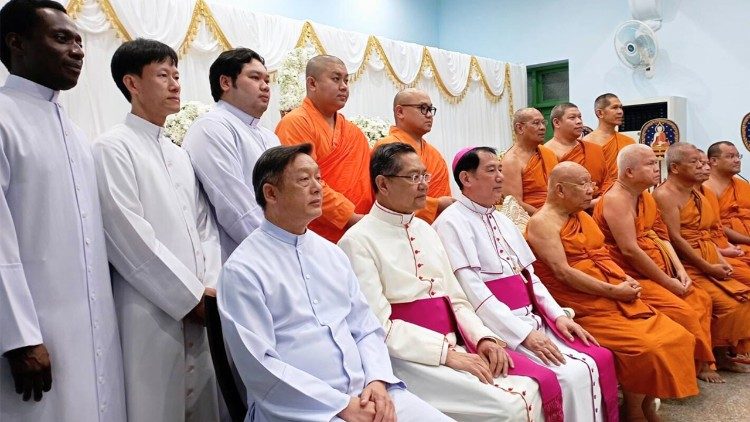 Buddhist and Catholics seated together