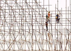 Workers on tall scaffolding