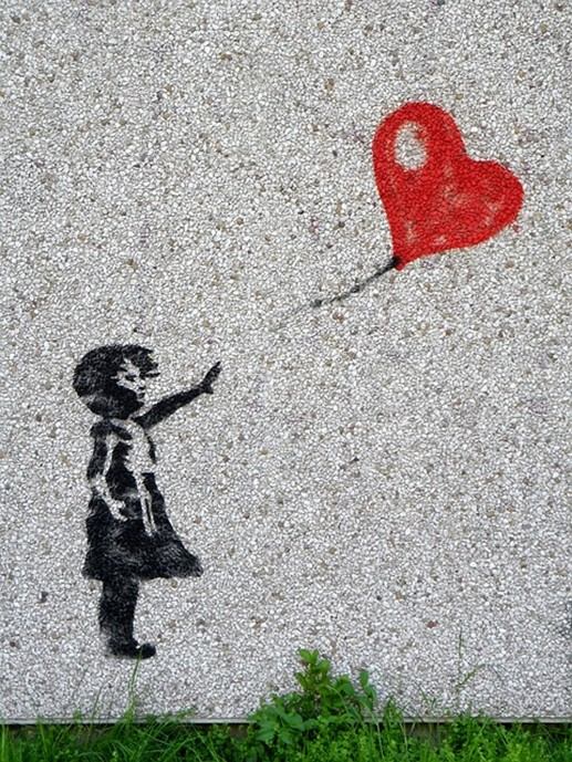 Banksy image of girl and heart-shaped balloon